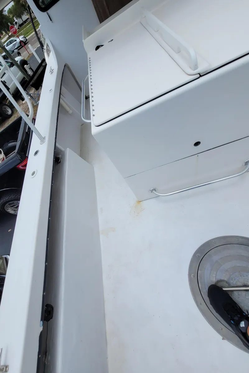 Slide: The Image of 1989 C-Hawk 29 boat deck with storage compartments and clean white surface. - 21