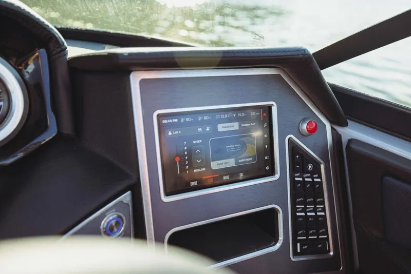 Slide: The Image of 2023 MasterCraft XT22 T dashboard with touchscreen controls. - 16