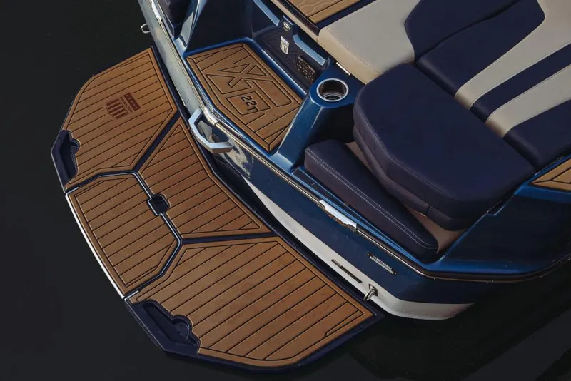 Slide: The Image of 2023 MasterCraft XT22 T boat with teak swim platform and luxurious seating. - 3