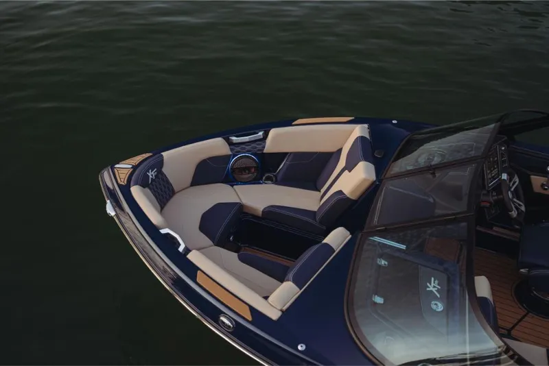 Slide: The Image of 2023 MasterCraft XT22 T boat with luxurious seating on calm water. - 4
