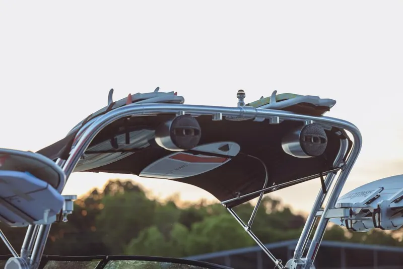 Slide: The Image of 2023 MasterCraft XT22 T boat with wakeboard tower and speakers. - 5