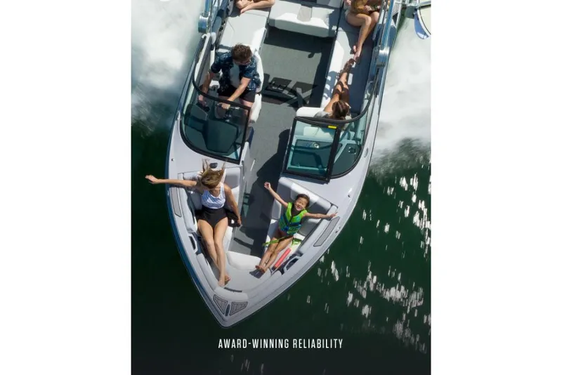 Slide: The Image of 2023 MasterCraft XT22 T boat with passengers enjoying a ride on the water. - 7