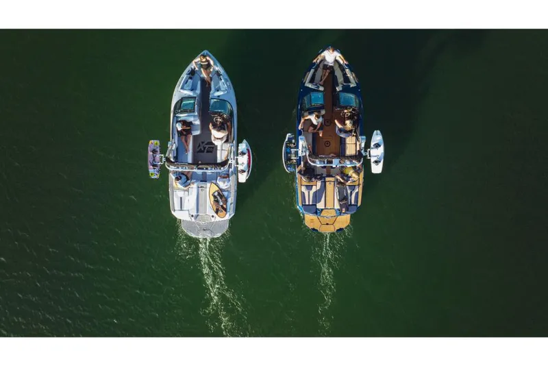 Slide: The Image of Aerial view of two 2023 MasterCraft XT22 T boats on the water. - 8