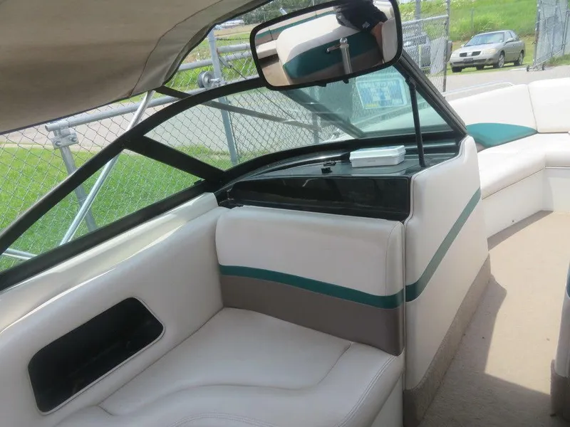 Slide: The Image of 1997 MasterCraft PT205 boat interior with white and green seating. - 4