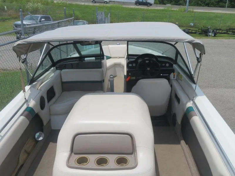 Slide: The Image of 1997 MasterCraft PT205 boat interior with canopy, seating, and steering wheel. - 5