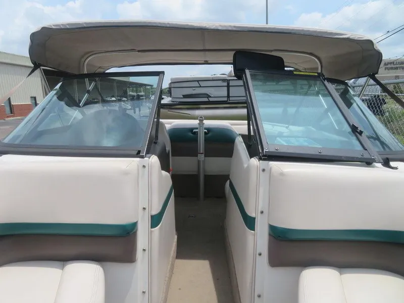 Slide: The Image of 1997 MasterCraft PT205 boat interior with open windshield and seating. - 9