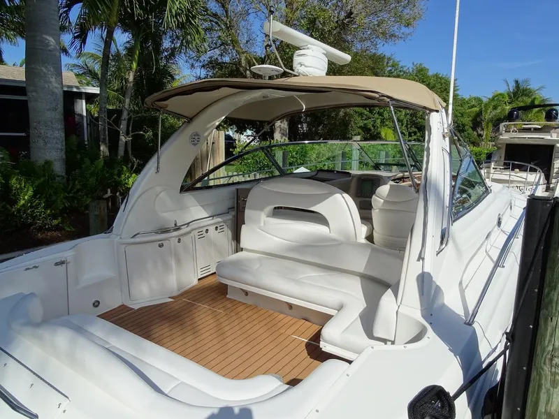 Slide: The Image of 2001 Sea Ray 410 Sundancer boat with spacious deck and seating area. - 1