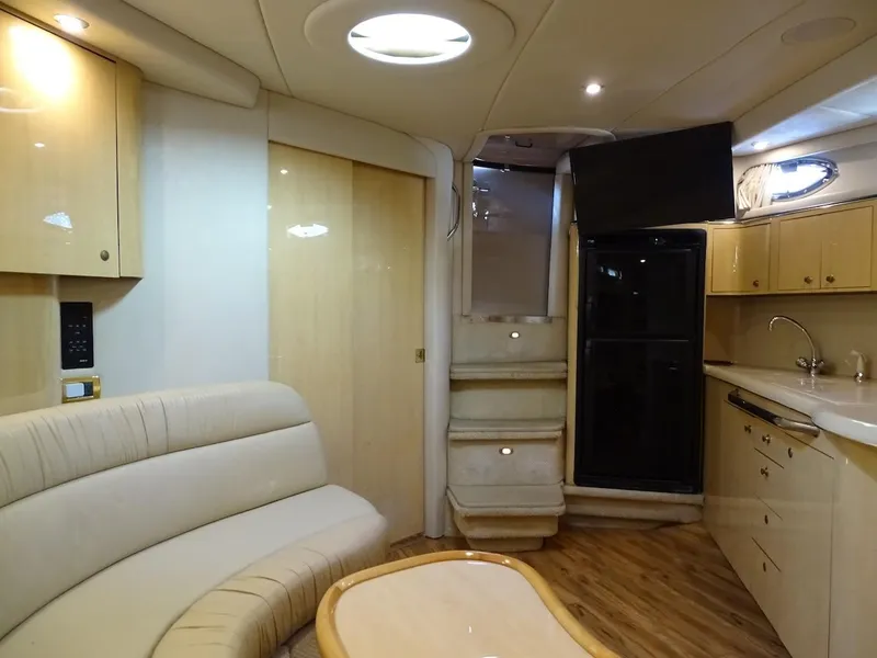 Slide: The Image of Luxurious interior of 2001 Sea Ray 410 Sundancer yacht with modern amenities. - 14