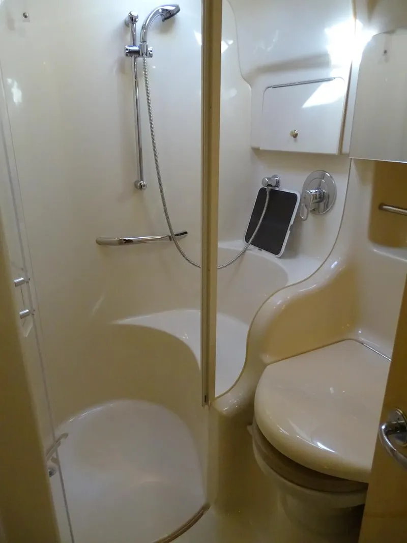 Slide: The Image of 2001 Sea Ray 410 Sundancer bathroom with shower and toilet. - 20