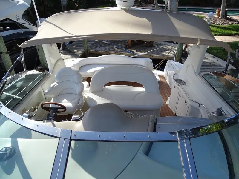 Slide: The Image of 2001 Sea Ray 410 Sundancer boat interior with white seating and canopy. - 22