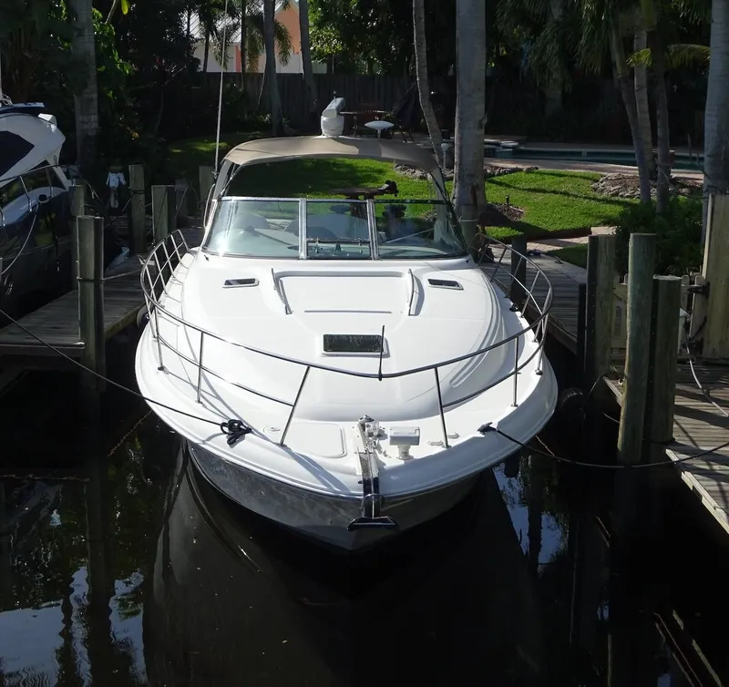 Slide: The Image of 2001 Sea Ray 410 Sundancer docked in a marina. - 23