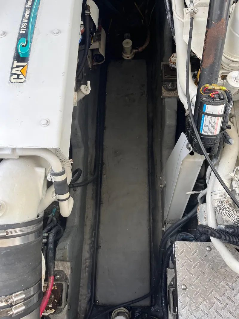 Slide: The Image of Engine compartment of a 2001 Sea Ray 410 Sundancer yacht. - 27