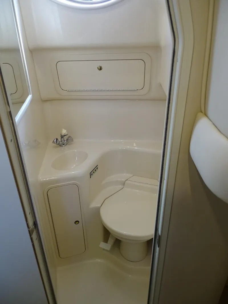 Slide: The Image of 2001 Sea Ray 410 Sundancer bathroom with sink and toilet. - 8
