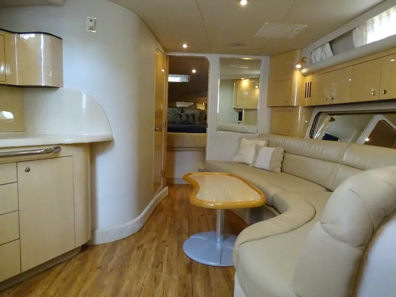 Slide: The Image of Interior of 2001 Sea Ray 410 Sundancer yacht with modern furnishings. - 9