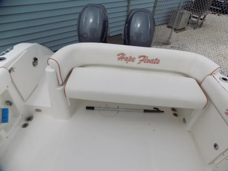 Slide: The Image of 2006 Century 24 Walkaround boat interior with "Hope Floats" on white seating. - 5