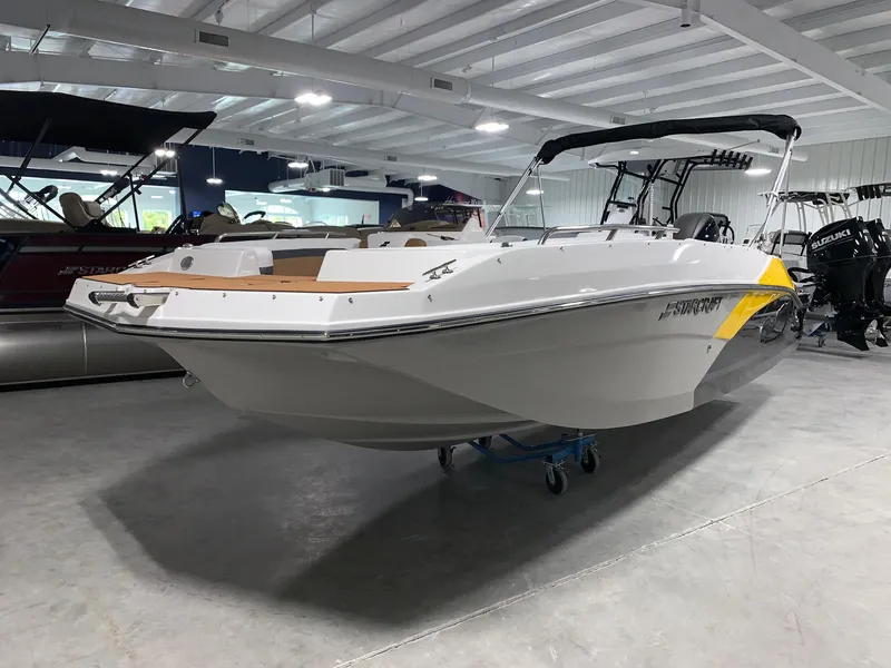 Slide: The Image of 2024 Starcraft SVX 211 boat displayed in a showroom. - 3