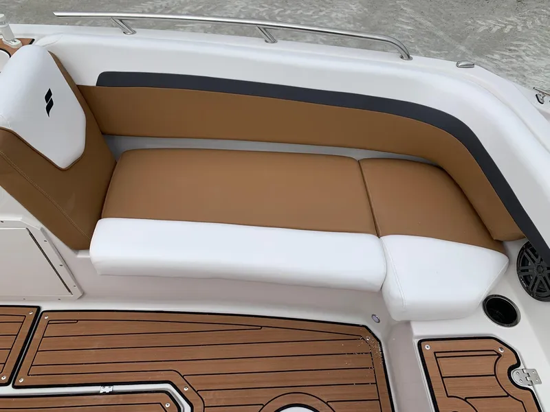 Slide: The Image of 2024 Starcraft SVX 211 boat interior with tan and white seating. - 6