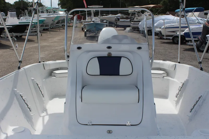 Slide: The Image of 2022 ALK2 Powerboats 18 CRS, white interior, docked among other boats. - 10