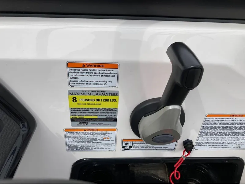 Slide: The Image of Yamaha Boats AR 190 2020 control panel with capacity and warning labels. - 10