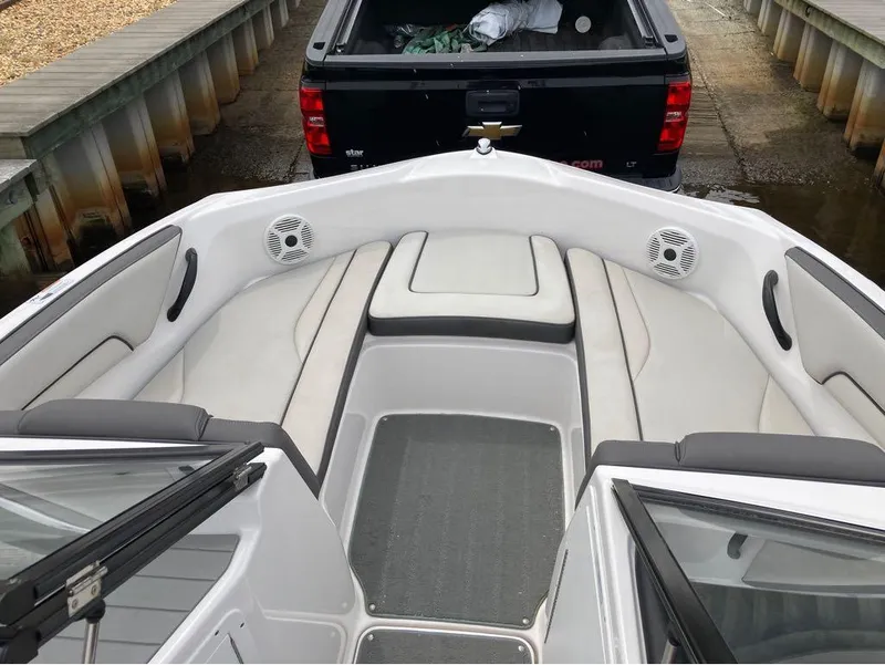 Slide: The Image of 2020 Yamaha Boats AR 190 interior with cushioned seating and speakers. - 12