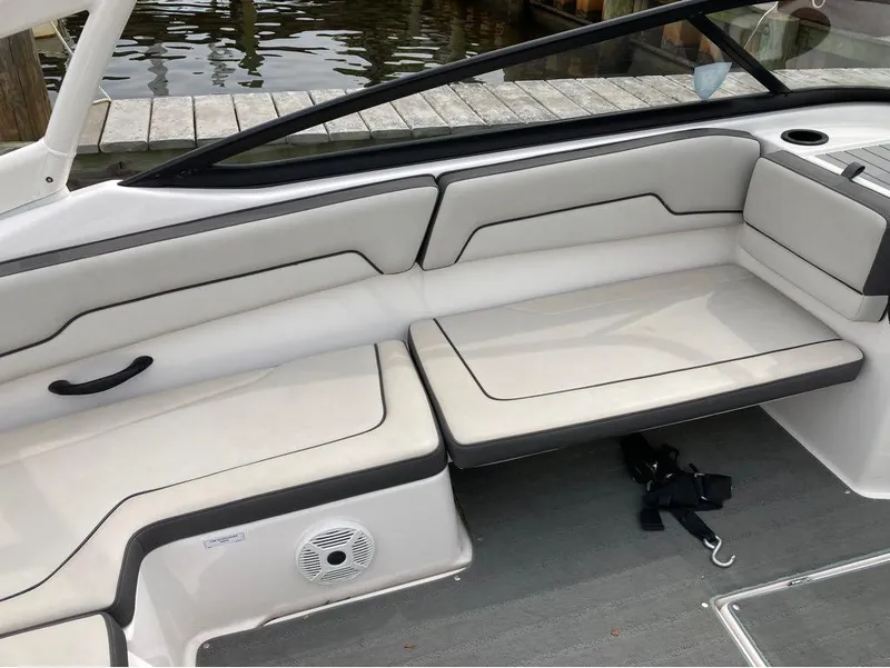 Slide: The Image of Interior seating of a 2020 Yamaha Boats AR 190, docked by the water. - 16