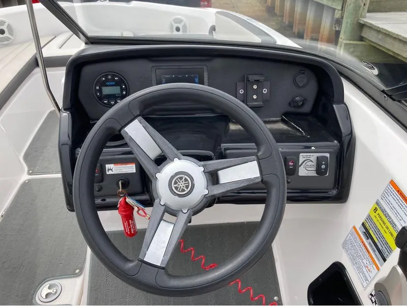 Slide: The Image of Steering console of a 2020 Yamaha Boats AR 190 with control panel and gauges. - 4