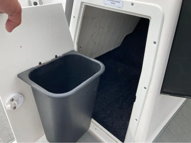 Slide: The Image of Yamaha Boats AR 190 2020 model storage compartment with trash bin. - 5