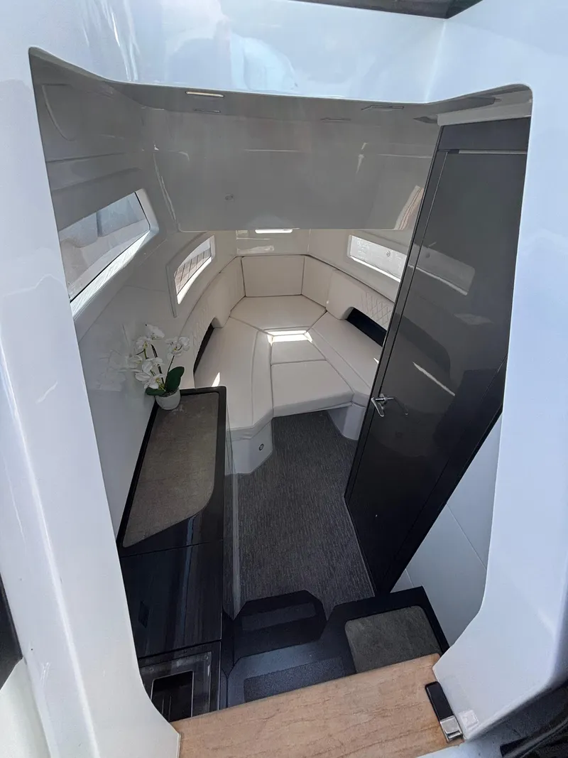 Slide: The Image of 2023 Schaefer V33 yacht docked at marina, featuring sleek design and spacious deck. - 11