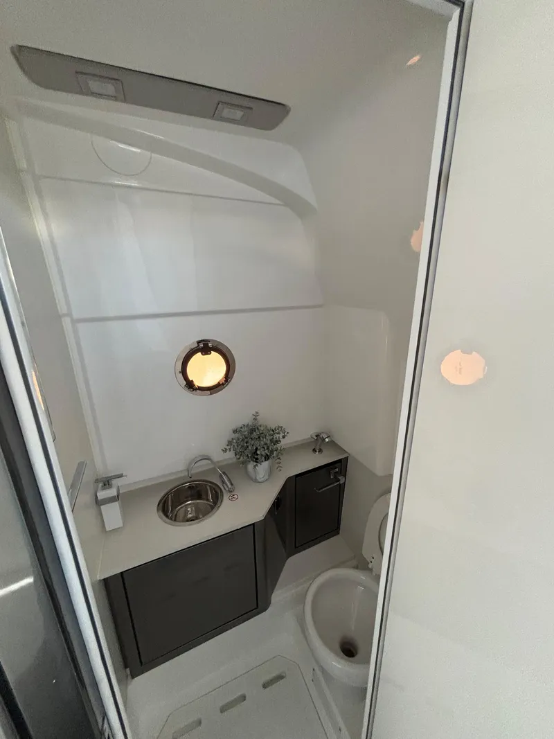 Slide: The Image of 2023 Schaefer V33 yacht interior with sleek design, featuring modern amenities and wooden deck. - 13