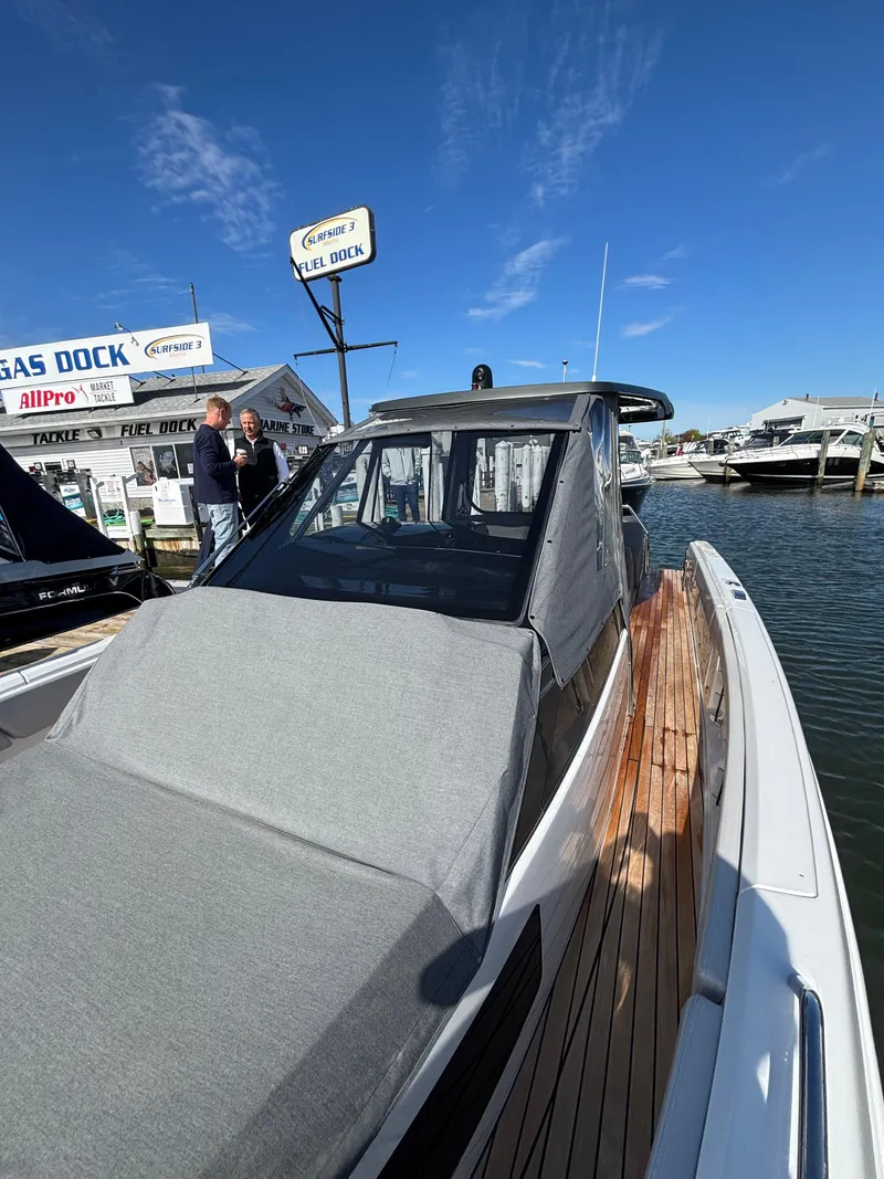 Slide: The Image of 2023 Schaefer V33 boat interior with white seating and modern design. - 16