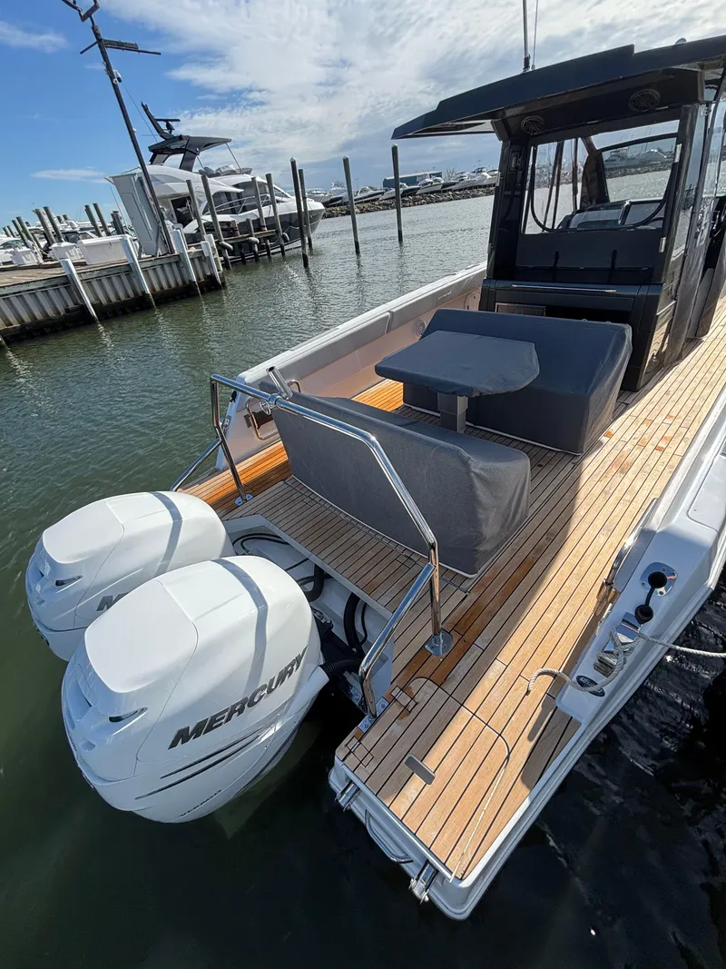 Slide: The Image of 2023 Schaefer V33 boat interior with white seating and modern design. - 5