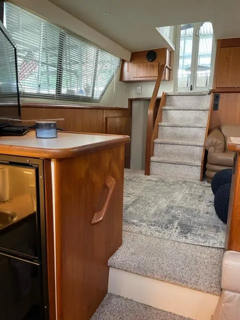 Slide: The Image of Interior of a 1996 Carver 370 yacht with leather seating and nautical decor. - 20