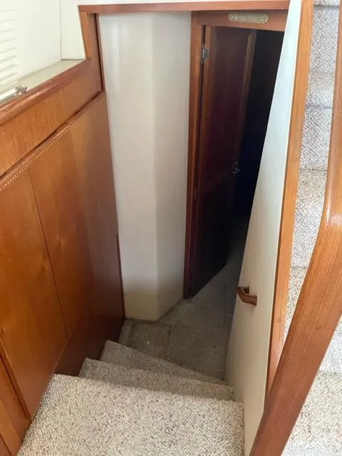 Slide: The Image of 1996 Carver 370 boat bathroom with sink, mirror, and toilet. - 34