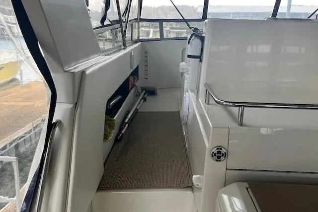 Slide: The Image of 1996 Carver 370 yacht interior with clean, spacious deck and modern amenities. - 45