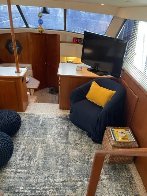 Slide: The Image of 1996 Carver 370 boat bathroom with sink, mirror, and toilet. - 24