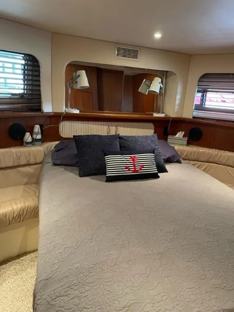 Slide: The Image of 1996 Carver 370 interior with compact refrigerator and storage unit. - 36