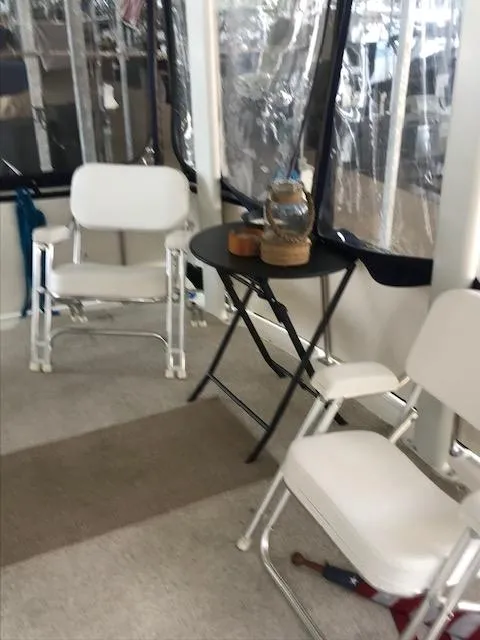 Slide: The Image of 1996 Carver 370 yacht docked in a covered marina. - 5