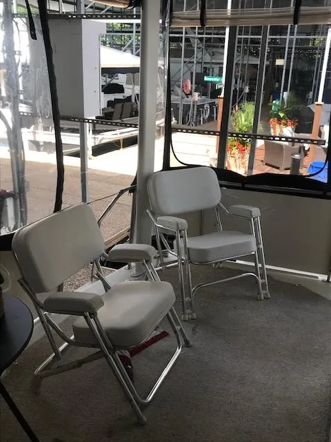 Slide: The Image of 1996 Carver 370 yacht docked in a covered marina. - 6