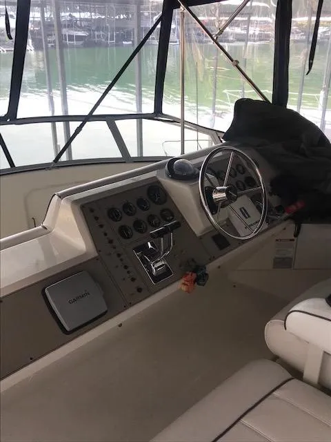 Slide: The Image of 1996 Carver 370 interior with white folding chairs. - 8