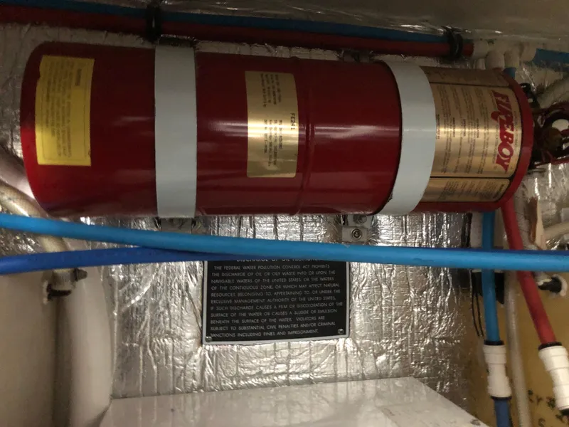 Slide: The Image of Fire extinguisher system in the engine compartment of a 2008 Rinker 350 Express Cruiser. - 14