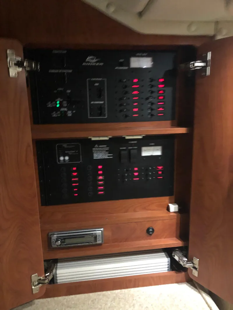 Slide: The Image of Electrical control panel inside a 2008 Rinker 350 Express Cruiser. - 6