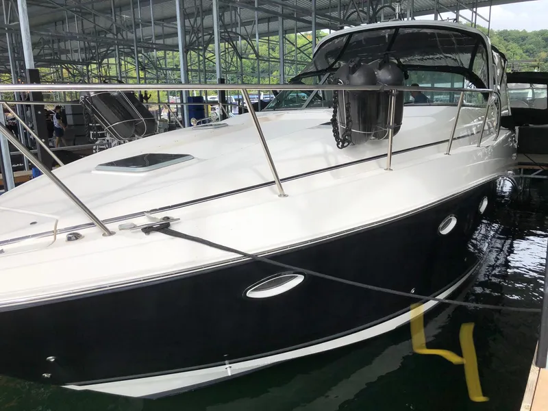 The Image of 2008 Rinker 350 Express Cruiser docked in a marina. - 0
