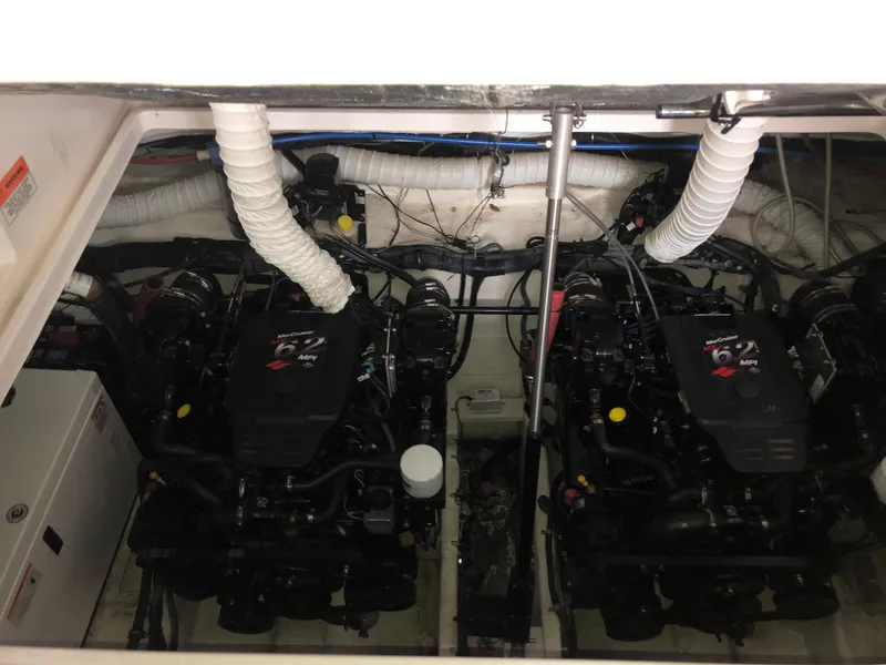Slide: The Image of 2008 Rinker 350 Express Cruiser engine compartment with twin MerCruiser engines. - 13