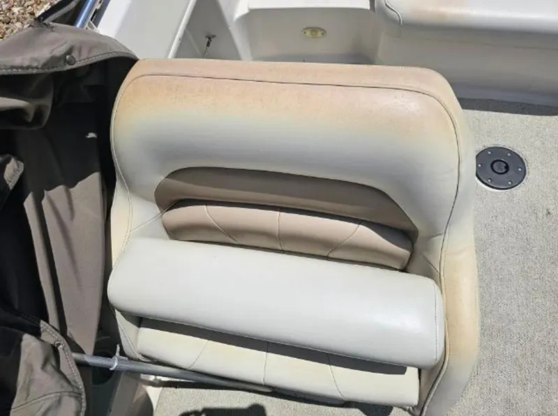 Slide: The Image of 2002 Hurricane Fun Deck GS 232 I/O boat seat with beige upholstery. - 14