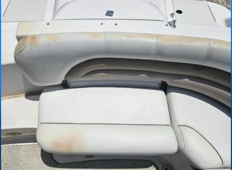 Slide: The Image of 2002 Hurricane Fun Deck GS 232 I/O boat seating with visible wear and discoloration. - 15
