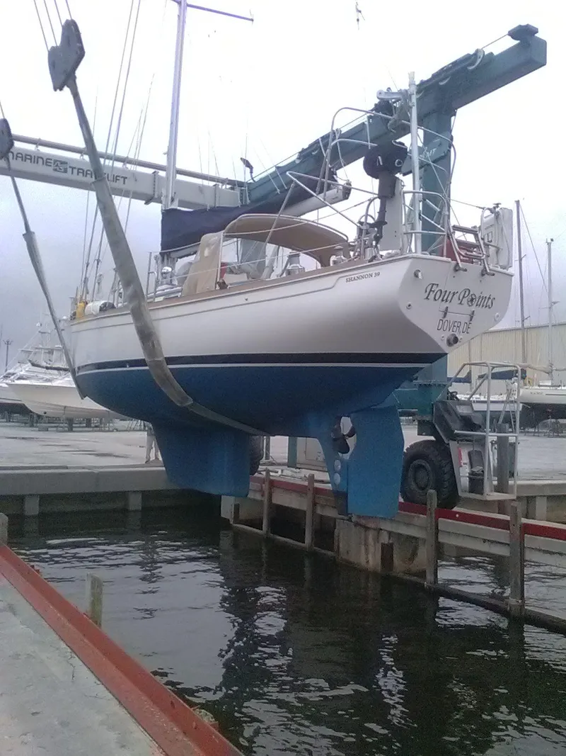 Slide: The Image of Sailboat "Four Points" on lift, Shannon 39 model, 1994, at marina dock. - 15