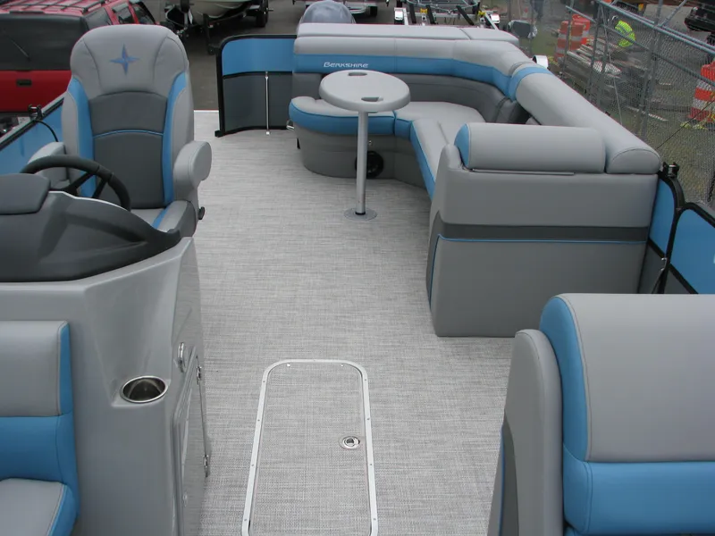 Slide: The Image of 2022 Berkshire 24CL2 CTS pontoon boat interior with gray and blue seating. - 11