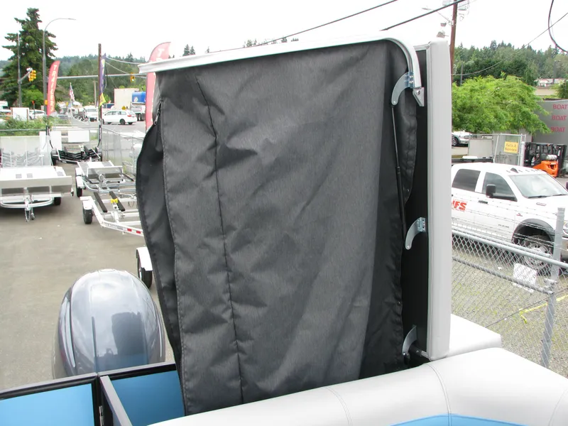 Slide: The Image of 2022 Berkshire 24CL2 CTS boat with black canvas cover. - 12