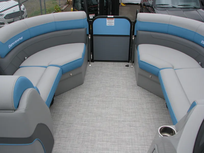 Slide: The Image of 2022 Berkshire 24CL2 CTS pontoon boat interior with gray and blue seating. - 8
