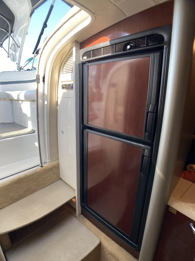 Slide: The Image of 2006 Formula 400 Super Sport interior with refrigerator and stairs. - 15